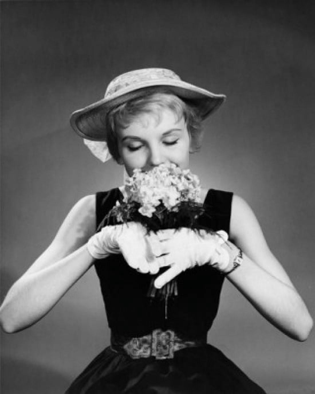 Close-up of a young woman smelling flowers Canvas Art - (18 x 24)