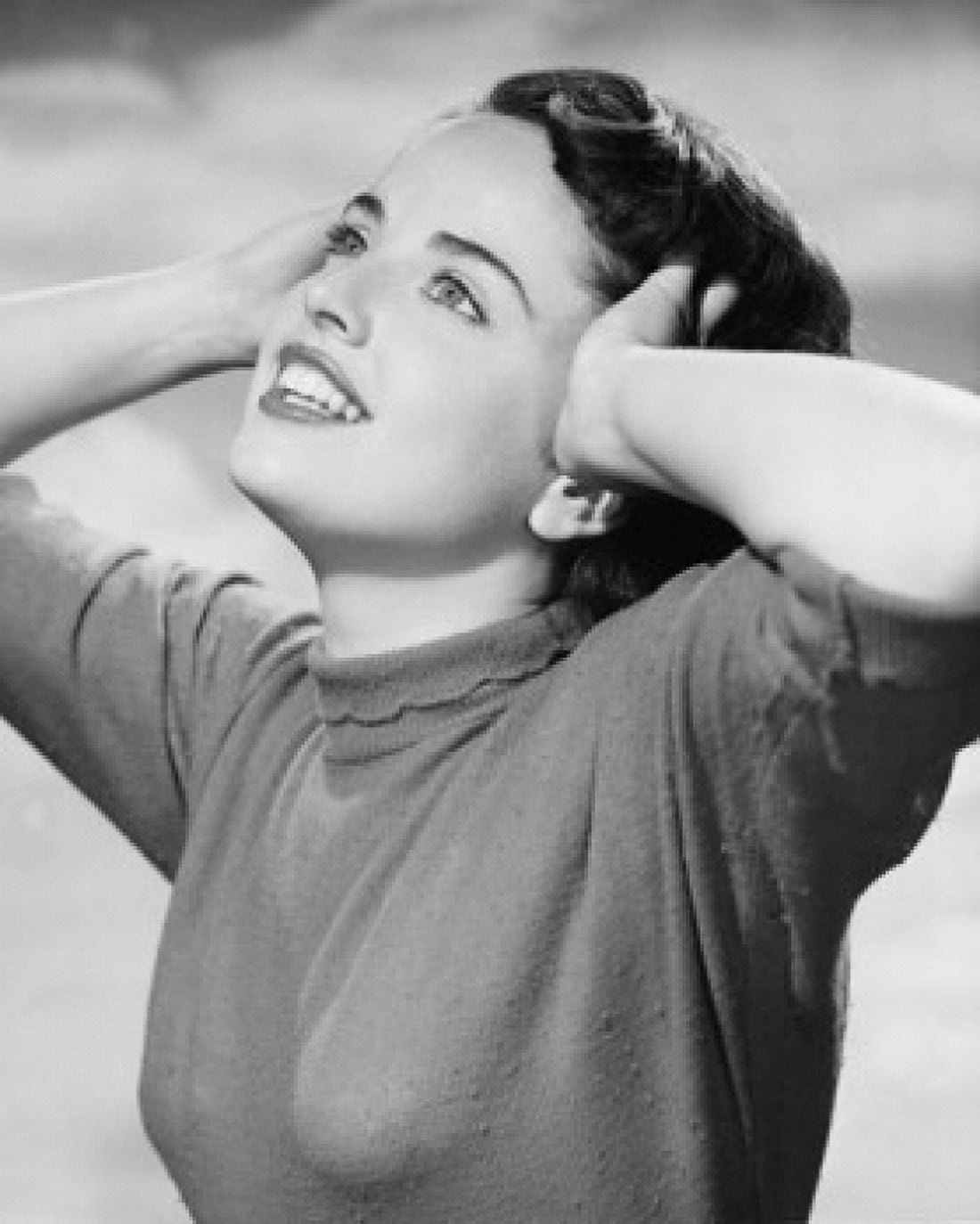 Close-up of a young woman smiling and holding her head Canvas Art - (24 x 36)