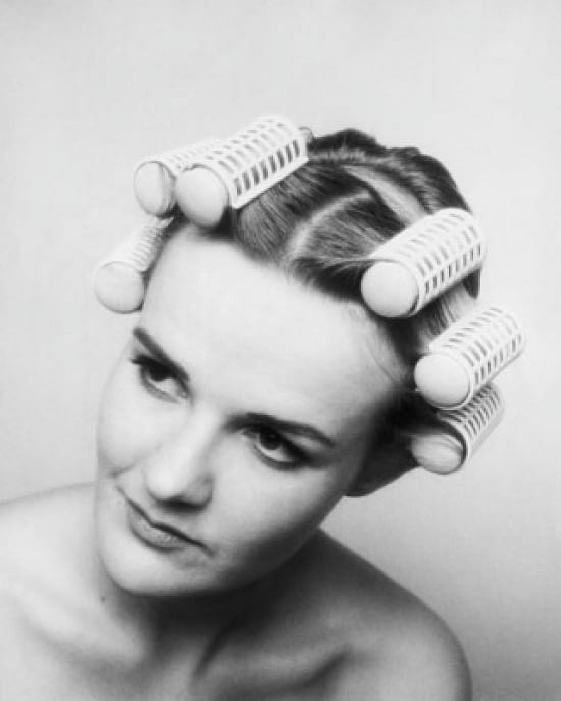Close-up of a young woman with hair curlers in her hair Canvas Art - (18 x 24)