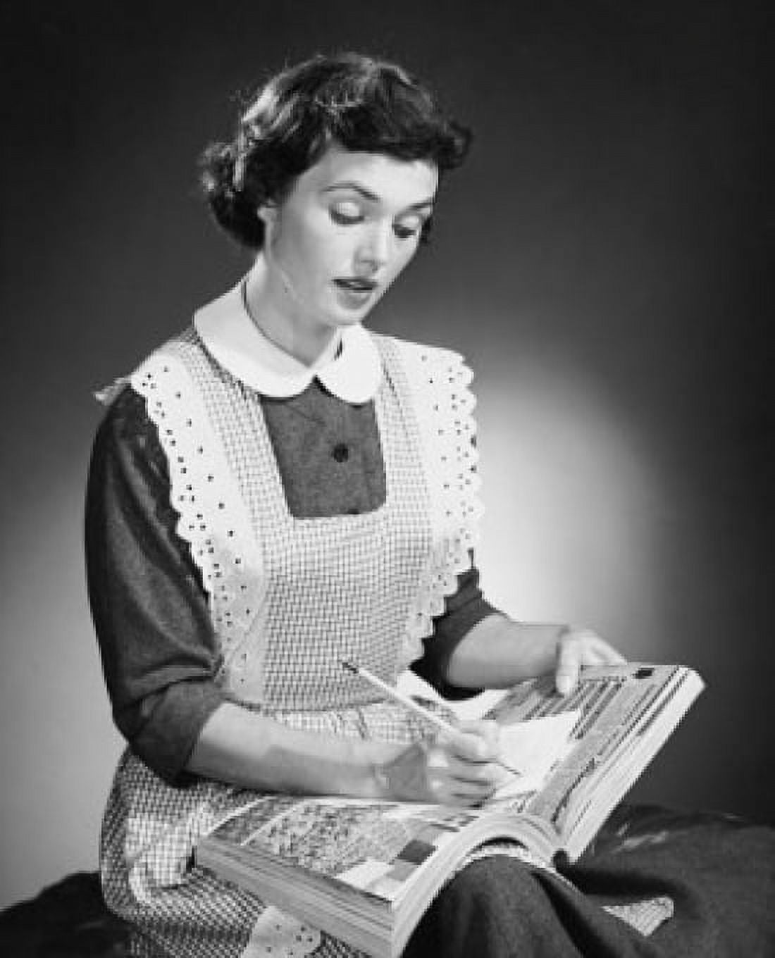 Close-up of a young woman writing on a catalogue Canvas Art - (18 x 24)