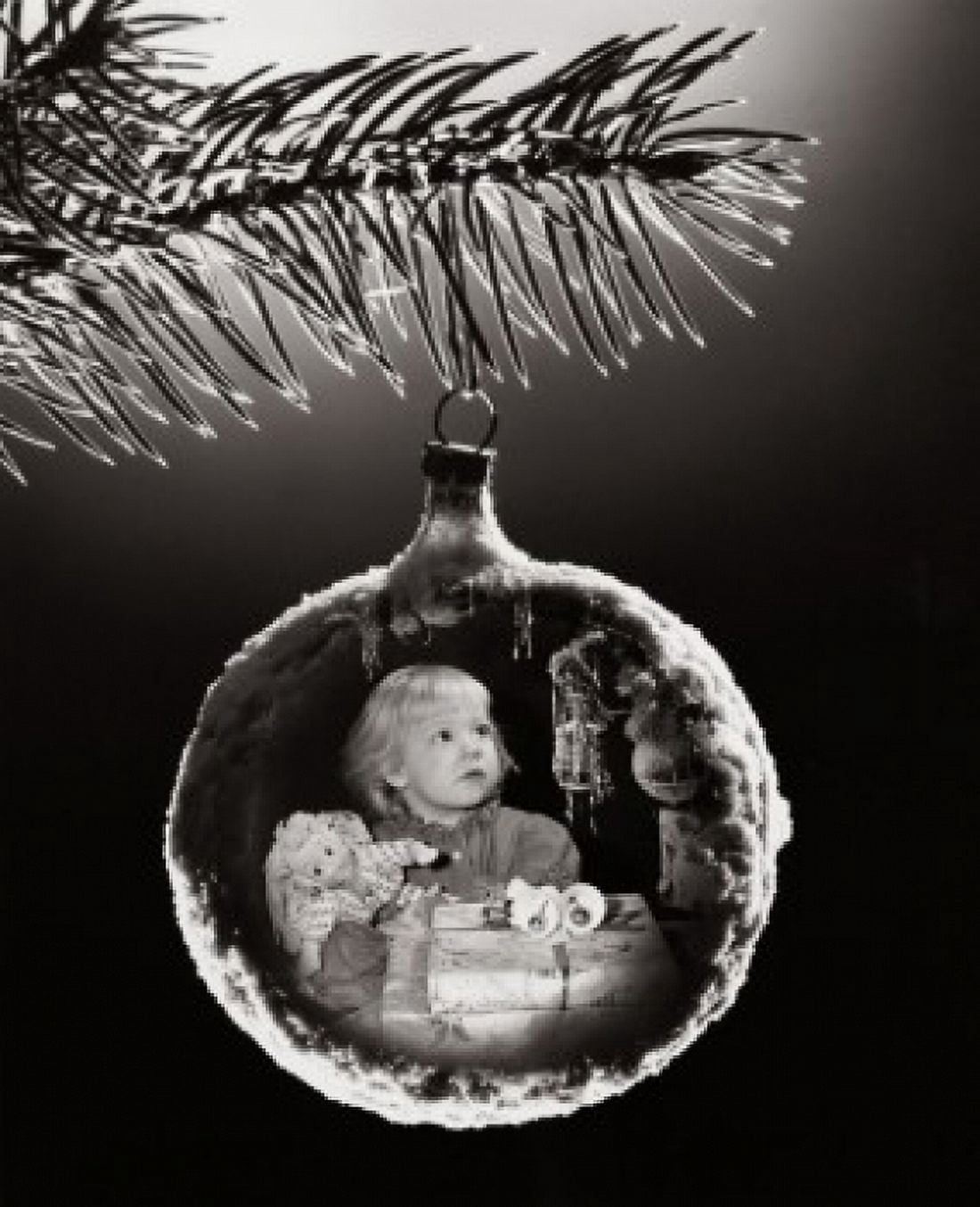 Close-up of an image of a girl with Christmas presents superimposed on a Christmas ornament Canvas Art - (18 x 24)