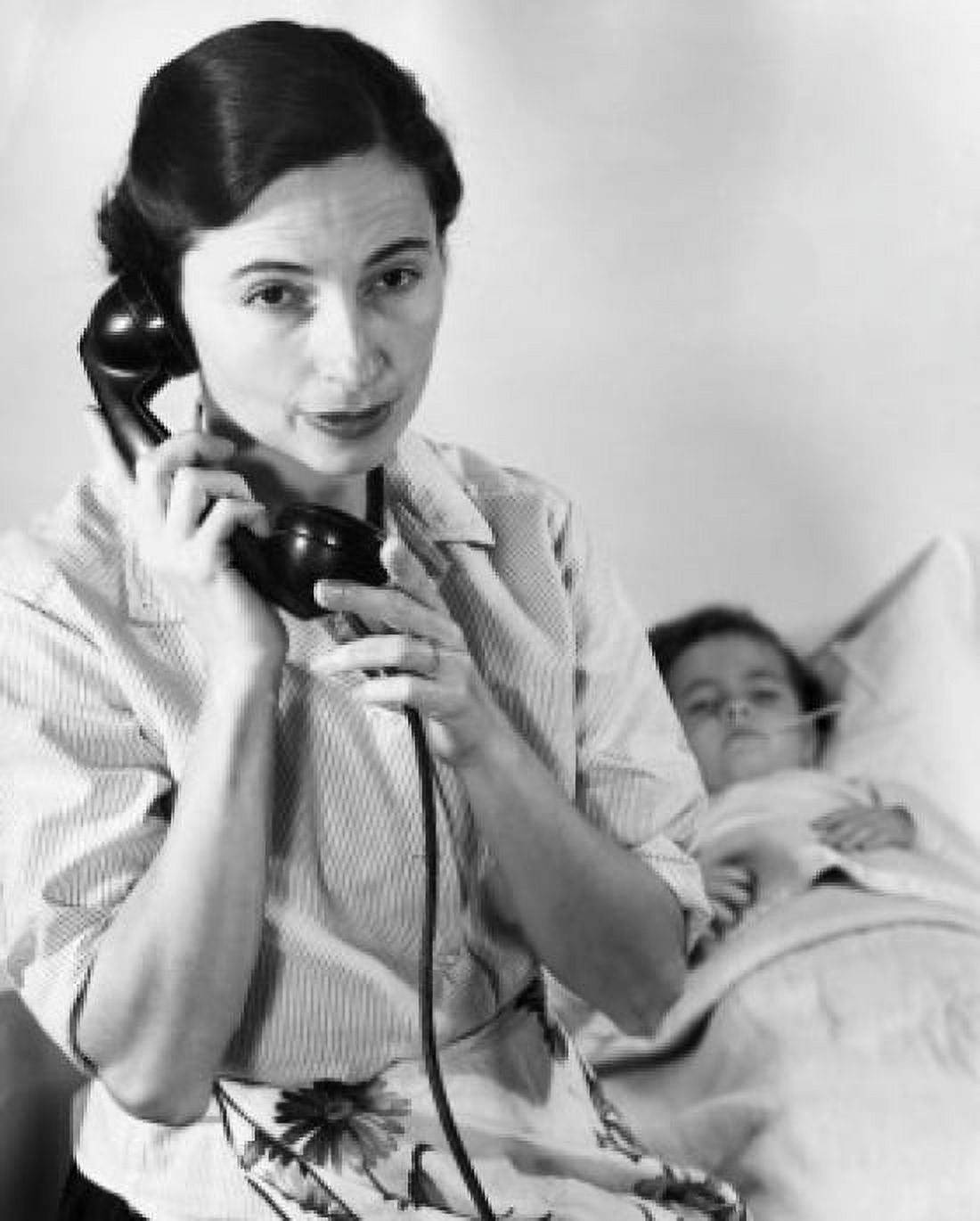 Close-up of female nurse using telephone sitting next to ill boy Canvas Art - (18 x 24)
