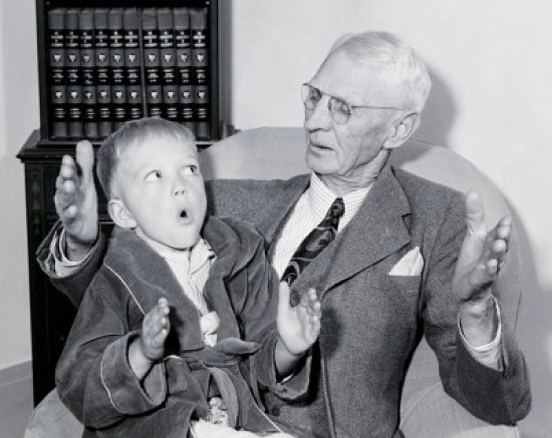 Close-up of grandfather sitting with grandson Canvas Art - (18 x 24)