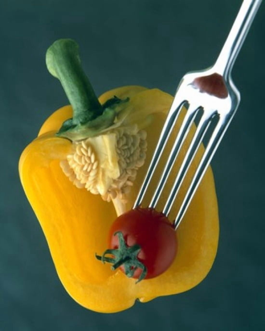 Close up of half yellow pepper with cherry tomato in center on fork tines Canvas Art - Panoramic Images (29 x 36)