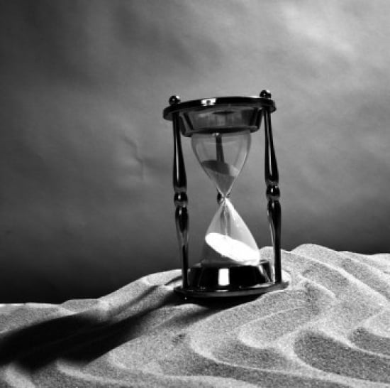 Close up of hourglass on sand Canvas Art - (18 x 24)