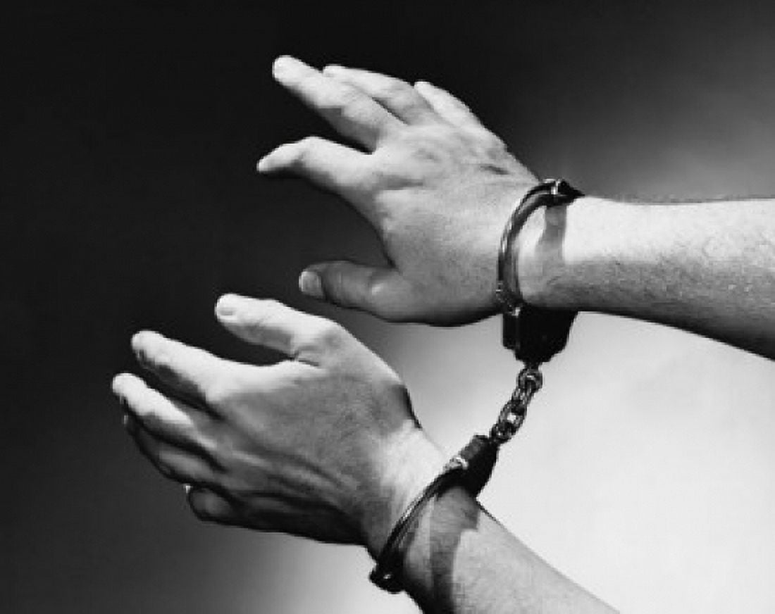 Close-up of mans hand wearing handcuffs Canvas Art - (24 x 36)