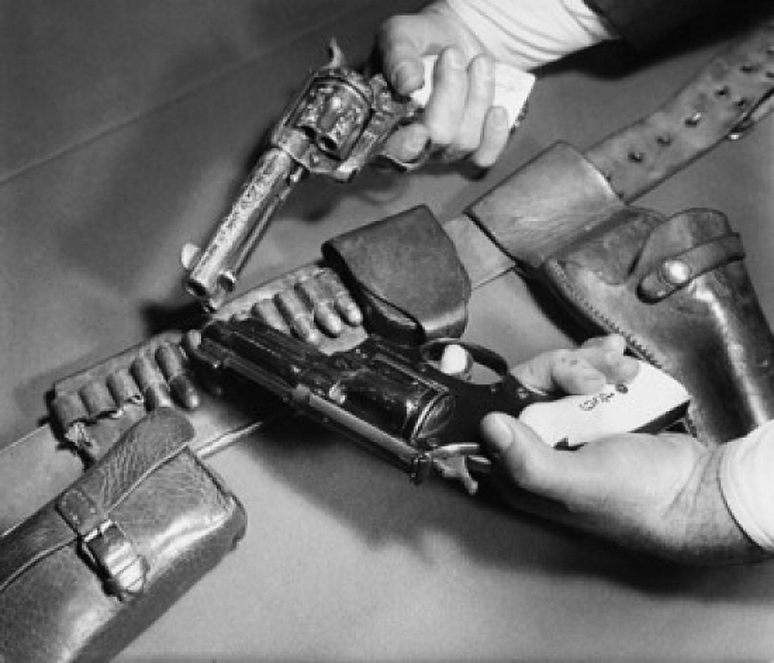 Close-up of mans hands holding a 45 Caliber Colt Army Revolver with a Smith and Wesson 357 Magnum Revolver Canvas Art - (24 x 36)