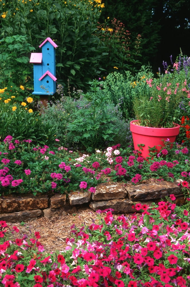 Close-up of multi-colored flowers and birdhouse in a garden Canvas Art - Panoramic Images (24 x 36)