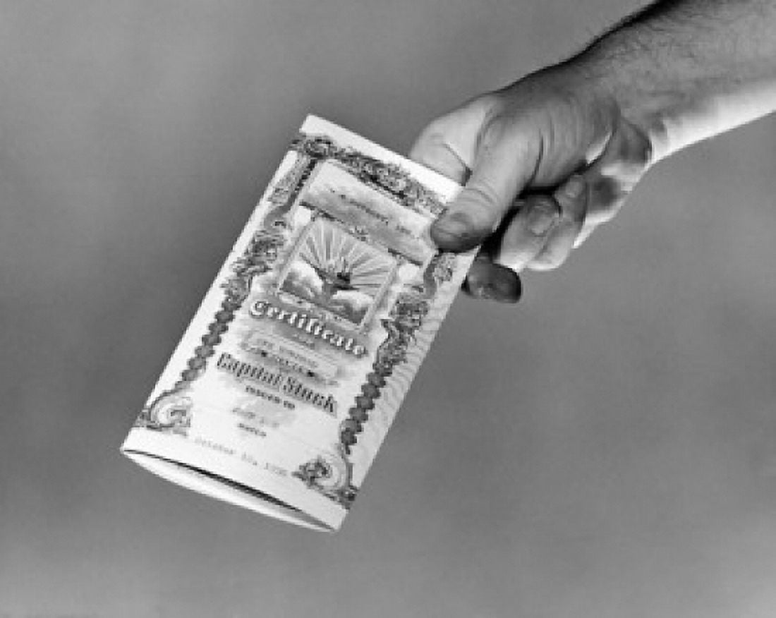 Close-up of persons hand holding a stock certificate Canvas Art - (24 x 36)