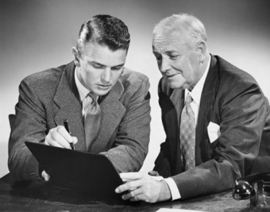Close-up of two businessmen reading a file Canvas Art - (24 x 36)