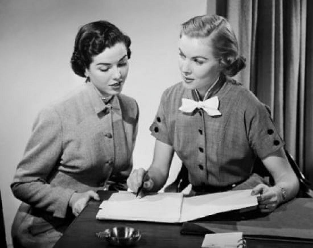 Close-up of two businesswomen discussing in an office Canvas Art - (18 x 24)