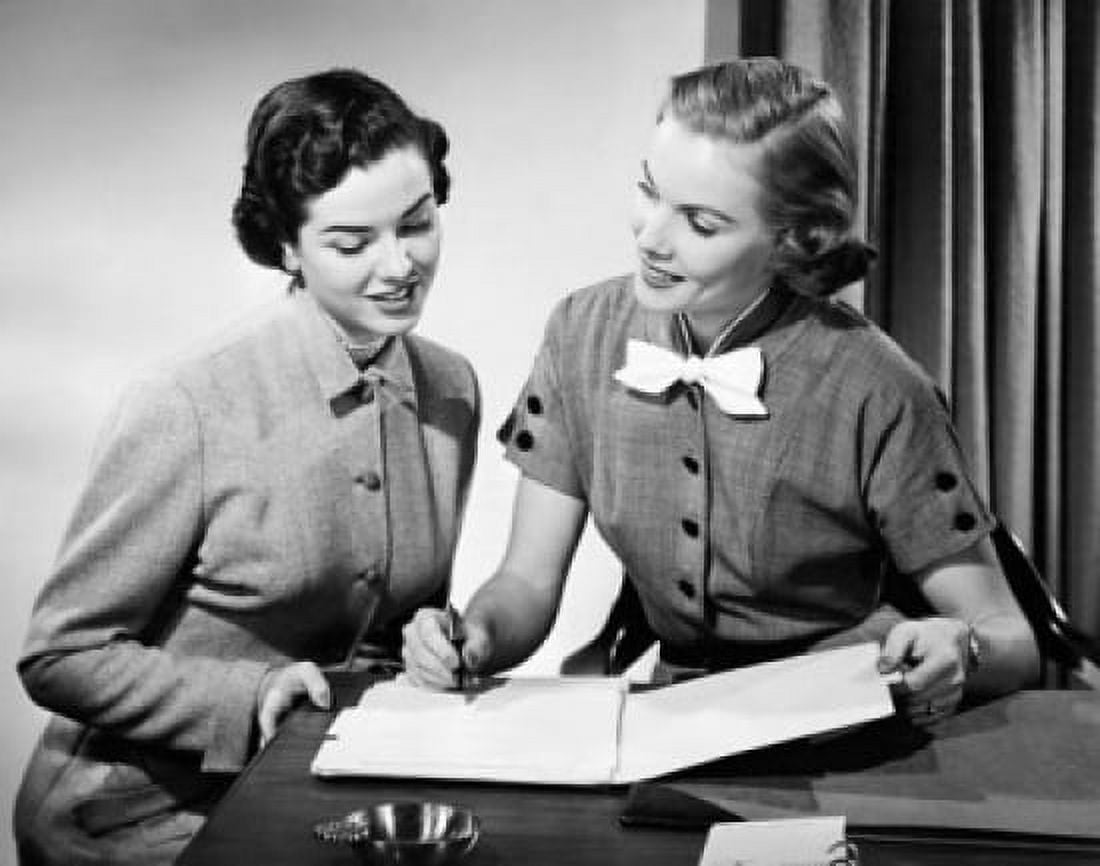 Close-up of two businesswomen discussing in an office Canvas Art - (18 x 24)