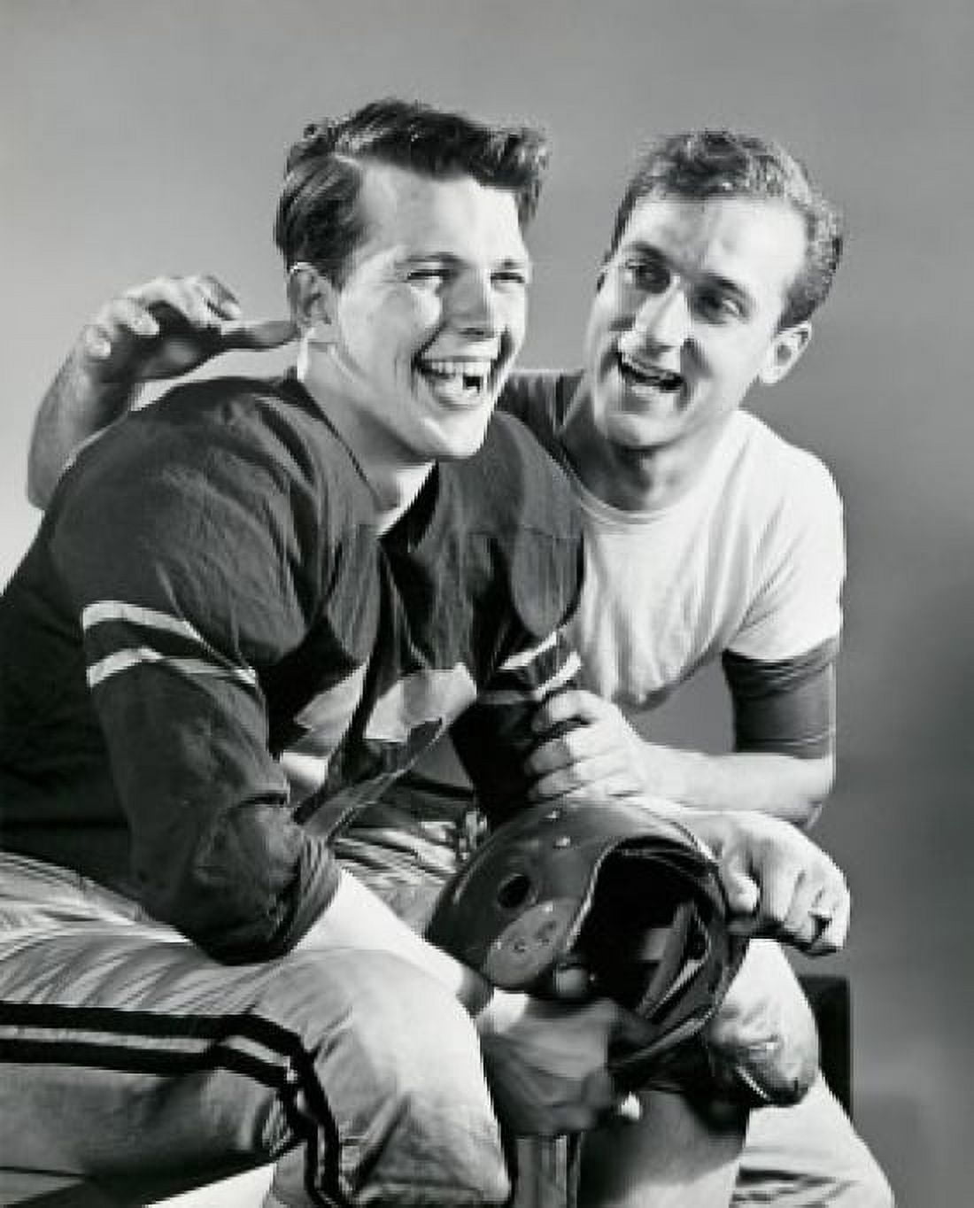 Close-up of two football players sitting together and smiling Canvas Art - (18 x 24)