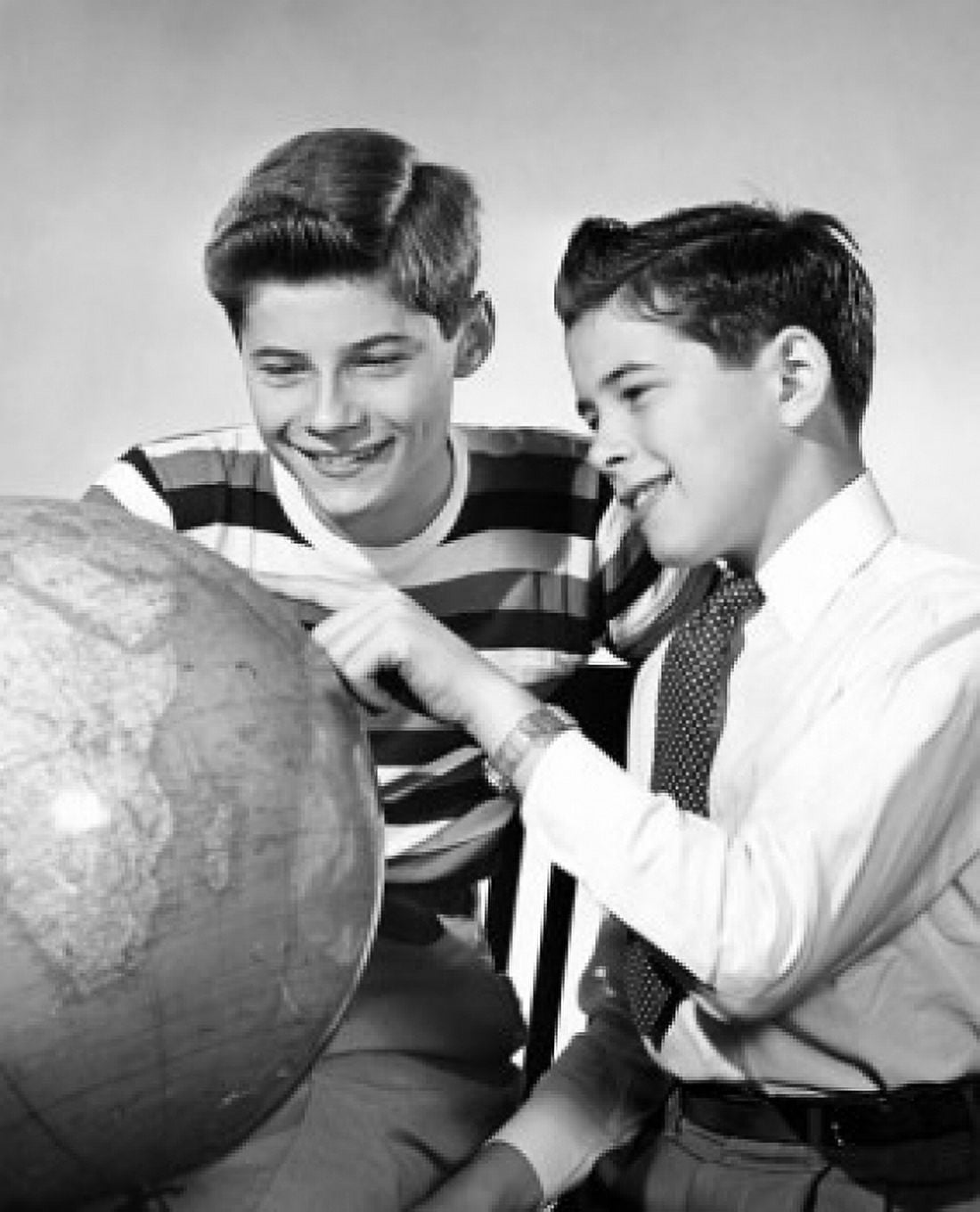 Close-up of two teenage boys looking at a globe Canvas Art - (18 x 24)
