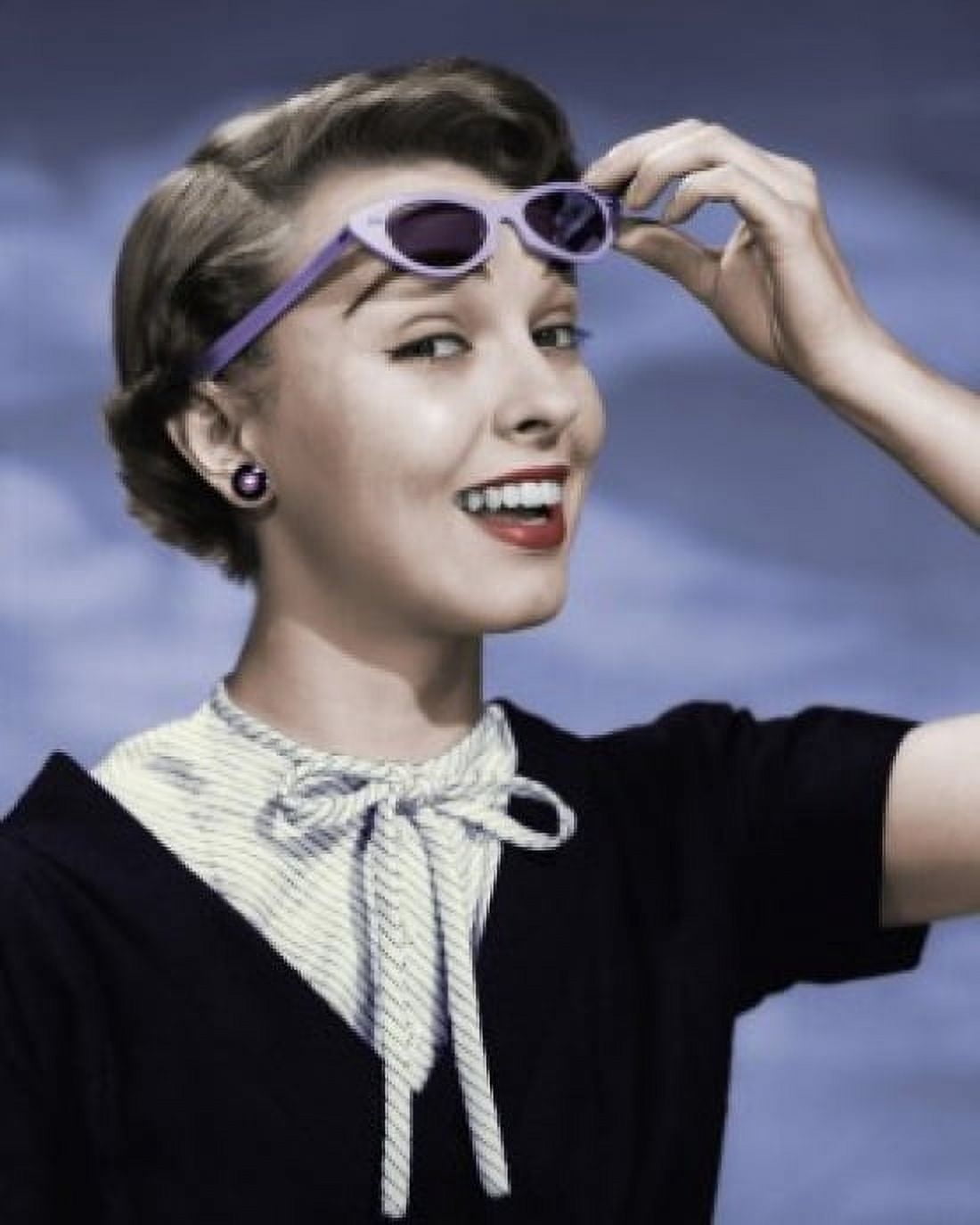 Close-up of young woman holding sunglasses Canvas Art - (24 x 36)