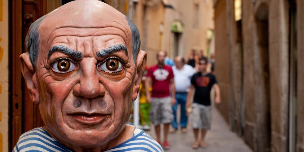 Close-up of a sculpture of Pablo Picasso a spanish painter at the entrance of a shop El Ingenio Barcelona Catalonia Spain Canvas Art - Panoramic Images (9 x 27)