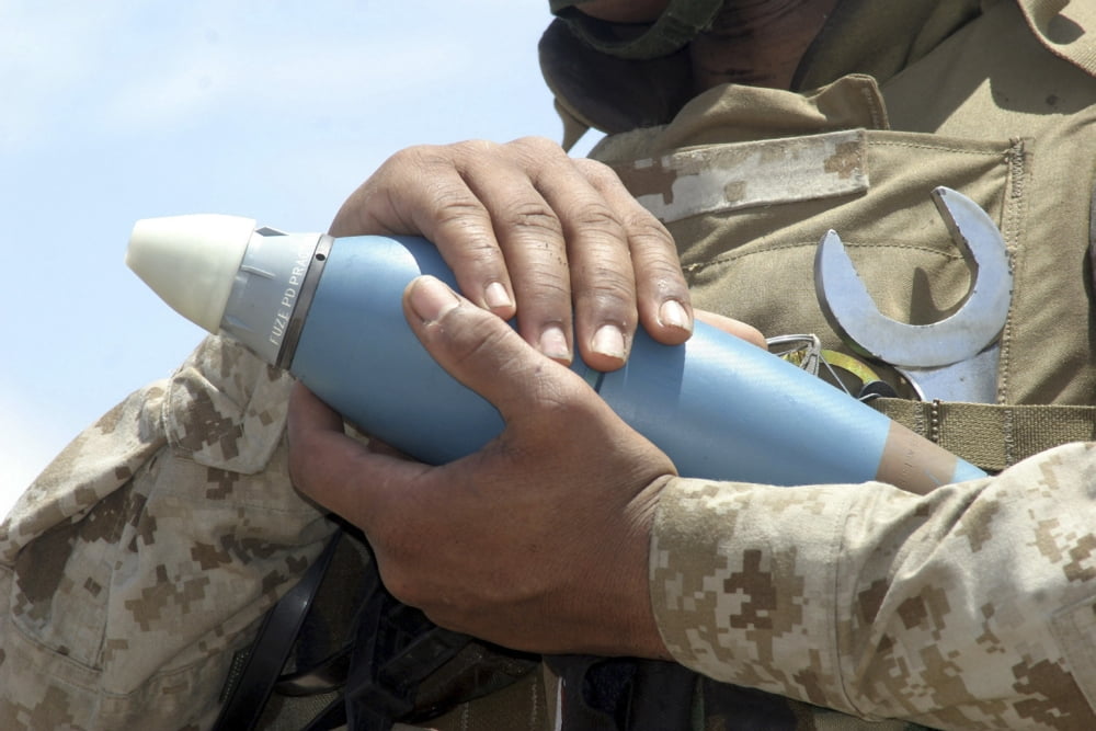 Close-up view of a soldier cradling a munition Canvas Art - Stocktrek Images (34 x 23)