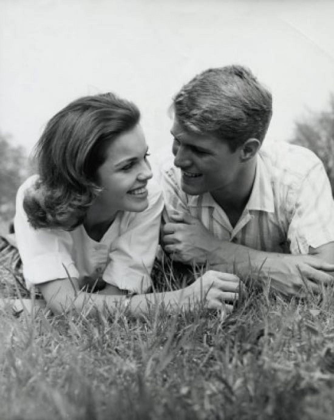 Close-up view of young couple lying in park Canvas Art - (18 x 24)