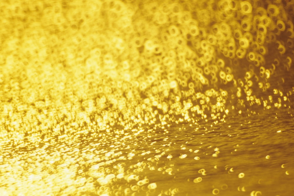 Closeup Of Golden Shimmering Reflections Off Water Canvas Art - Mary Van de Ven Design Pics (34 x 22)