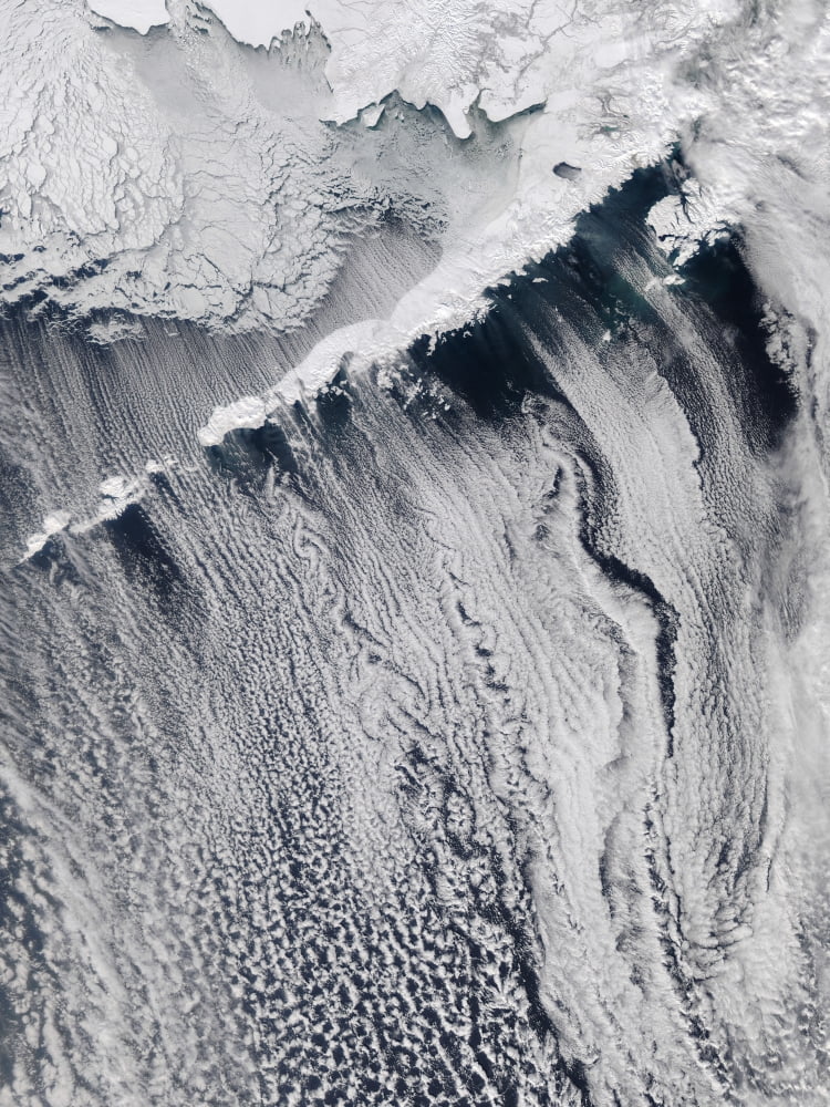 Cloud patterns visible over the Aleutian Islands Canvas Art - Stocktrek Images (25 x 33)