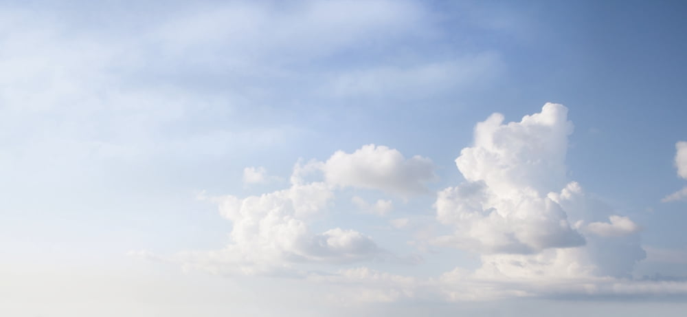 Clouds in a blue sky Toronto Ontario Canada Canvas Art - directedphoto Design Pics (22 x 10)