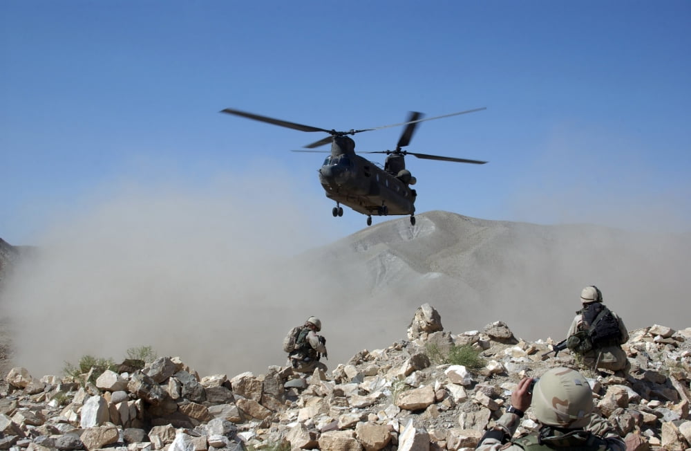 Clouds of dust kicked up by the rotor wash of a CH-47 Chinook helicopter in Afghanistan Canvas Art - Stocktrek Images (35 x 23)