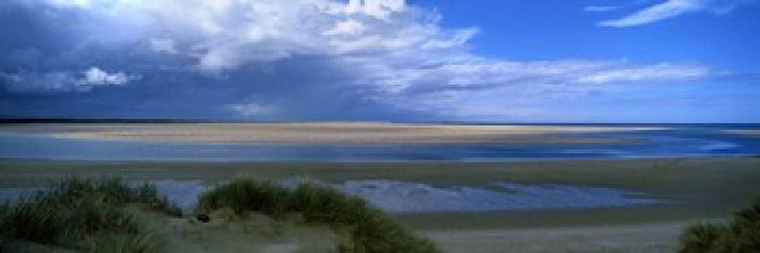 Clouds over Budle Bay Northumberland England Canvas Art - Panoramic Images (18 x 6)