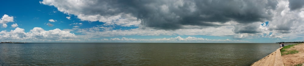 Clouds over a lake Lake Pontchartrain New Orleans Louisiana USA Canvas Art - Panoramic Images (56 x 12)