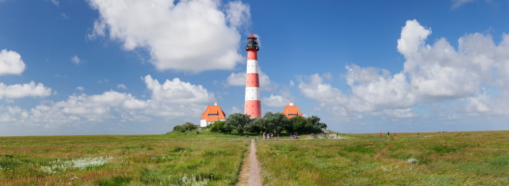 Clouds over a lighthouse Westerheversand Lighthouse Westerhever Eiderstedt Schleswig-Holstein Germany Canvas Art - Panoramic Images (36 x 12)