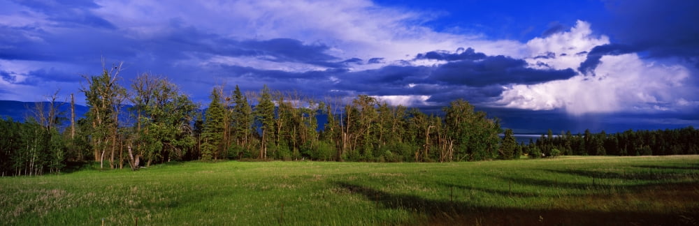 Clouds over a valley Flathead Lake US Glacier National Park Montana USA Canvas Art - Panoramic Images (27 x 9)