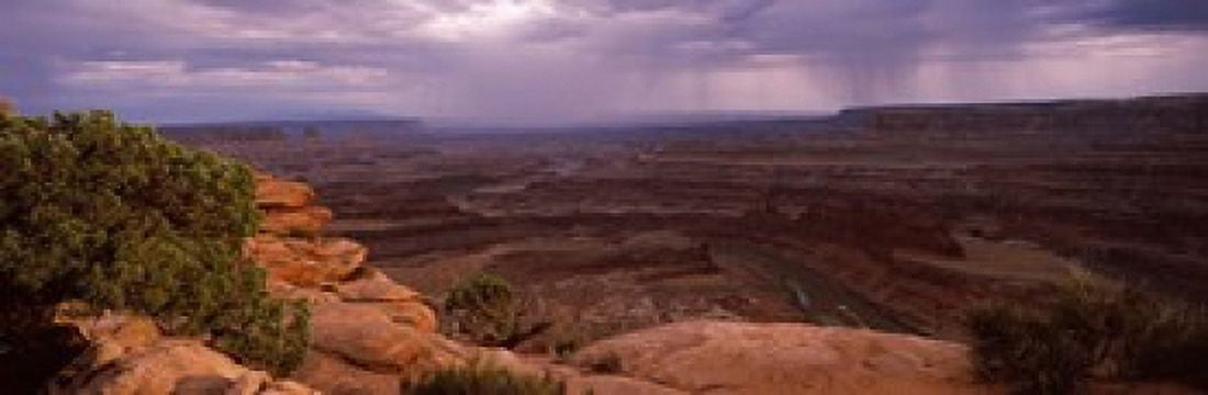 Clouds over an arid landscape Canyonlands National Park San Juan County Utah USA Canvas Art - Panoramic Images (18 x 6)