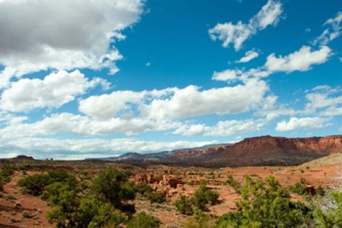 Clouds over an arid landscape Capitol Reef National Park Utah USA Canvas Art - Panoramic Images (36 x 24)