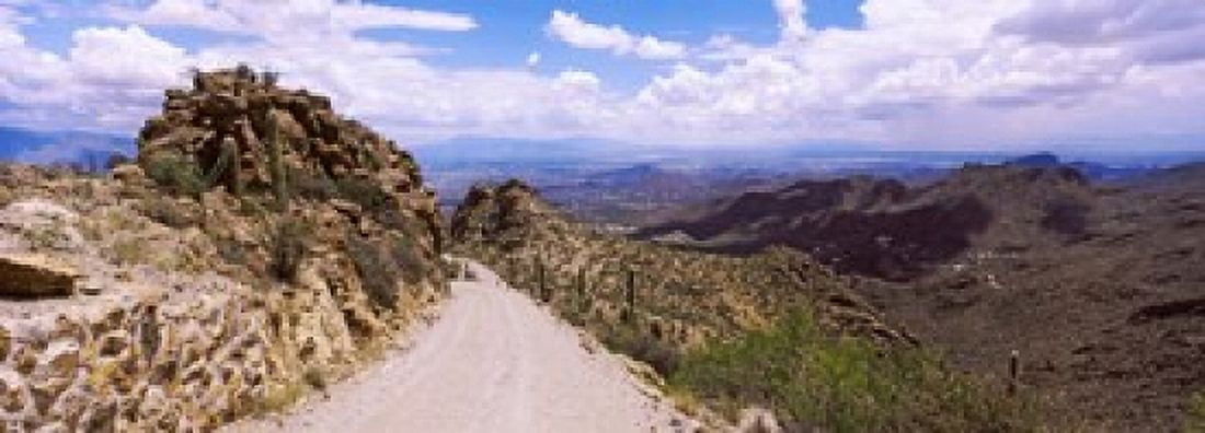 Clouds over the Tucson Mountain Park Tucson Arizona USA Canvas Art - Panoramic Images (18 x 7)