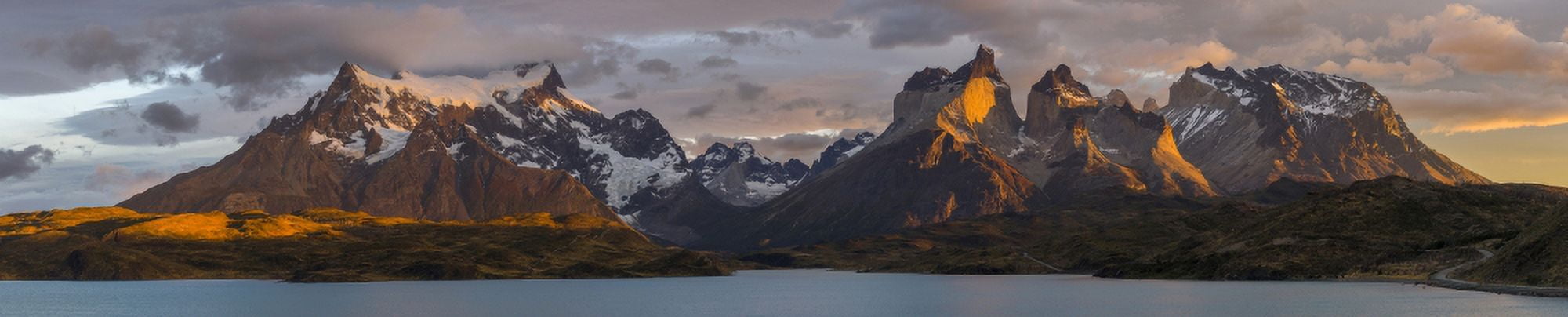 Clouds at sunrise over Paine Grande (L) and the Cuernos (R) from Lake Pehoe Torres Del Paine National Park Chile Canvas Art - Panoramic Images (27 x 9)