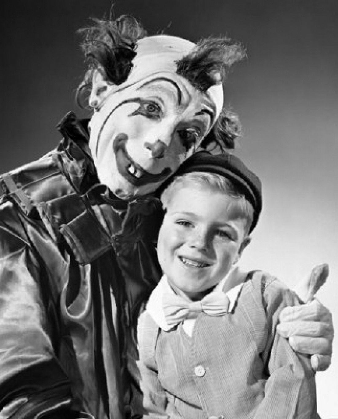 Clown hugging a boy and smiling Canvas Art - (18 x 24)