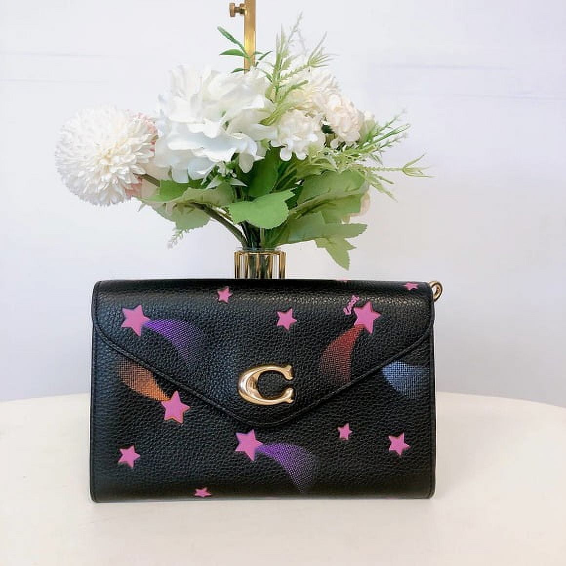 COACH Women's Tammie Pebbled Leather Medium Clutch Crossbody Bag with Disco Star Print (Black Multi)