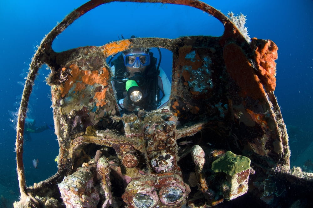 Cockpit of a Mitsubishi Zero fighter plane wreck underwater Canvas Art - Steve JonesStocktrek Images (35 x 23)
