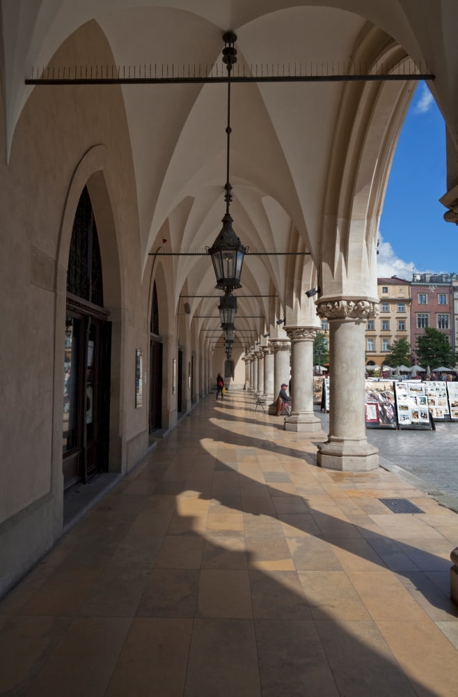 Colonade along the side of Sukiennice The Renaisssance Cloth Hall Rynek Glowny The Main Market Square Krakow Poland Canvas Art - Panoramic Images (27 x 9)