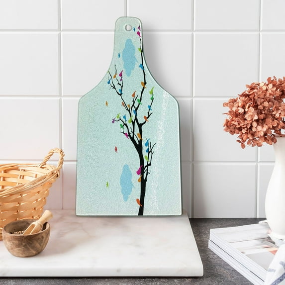 Colorful Cutting Board, Winged Birds Sitting and Tweeting on the Leafless Winter Tree with Fluffy Clouds, Tempered Glass Cutting and Serving Board, Wine Bottle Shape, Multicolor, by Ambesonne