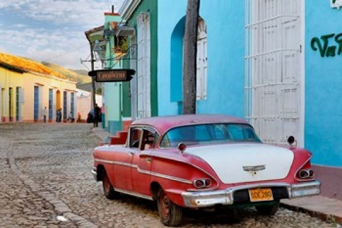 Colorful buildings and 1958 Chevrolet Biscayne Trinidad Cuba Canvas Art - Adam Jones DanitaDelimont (19 x 13)