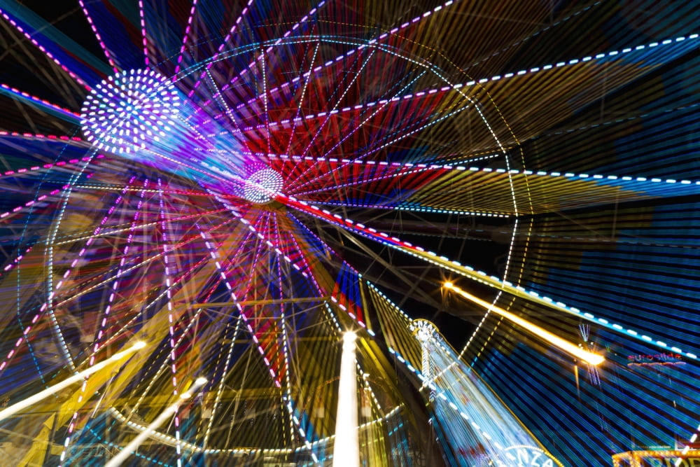 Colourful lights of a moving ferris wheel at nighttime Calgary Alberta Canada Canvas Art - Michael Interisano Design Pics (19 x 12)
