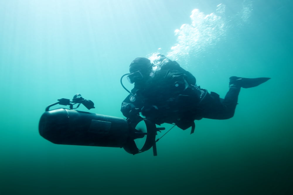 Combat diver navigates the waters using a diver propulsion vehicle Canvas Art - Tom WeberStocktrek Images (18 x 12)