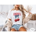 thumbnail image 1 of Comfort Colors® 4th of July America CherryT- Shirt, Patriotic Coquette Bow Graphic Tee, USA Flag Cherries T-Shirt, Cute Women Independence Day Top, 1 of 5