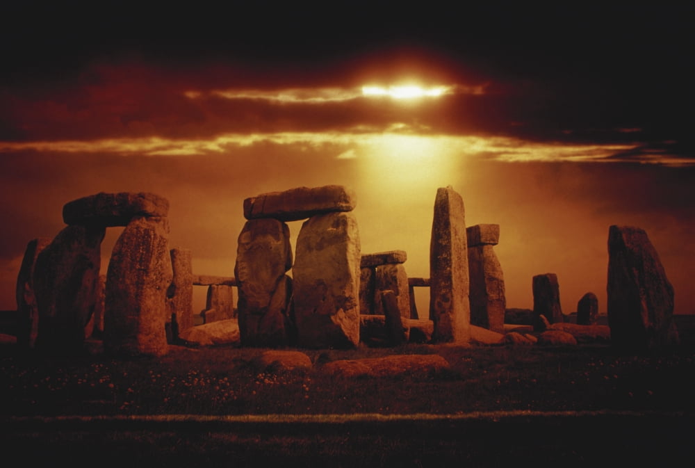 Composite of a sunset over Stonehenge Wiltshire England Canvas Art - Stocktrek Images (34 x 23)