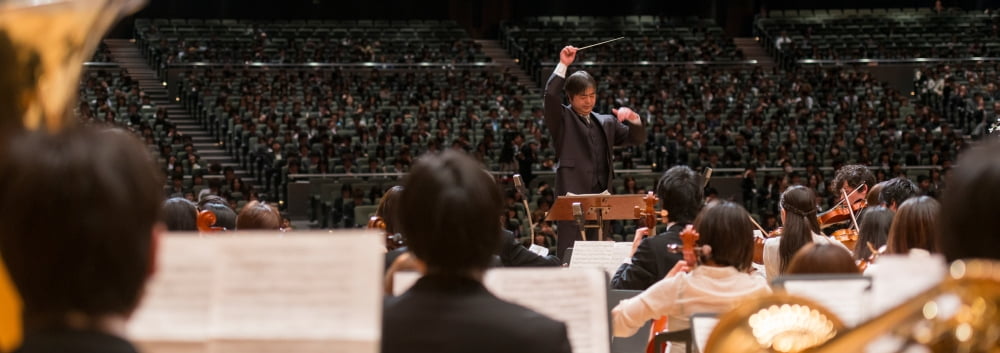 Conductor leading orchestra in a university concert Singapore Canvas Art - Panoramic Images (36 x 12)
