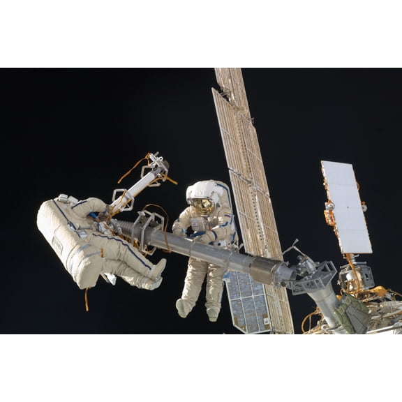 Construction Work On International Space Station. Russian Cosmonauts Oleg Kononenko And Anton Shkaplerov In A Six Hour Spacewalk. They Moved The Russian Built Strela-1 Robotic Arm For Future