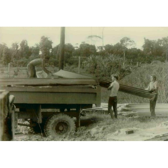 Construction Workers And Bobby Stroud And Others Unloading A Truck. People'S Temple Agricultural Project.