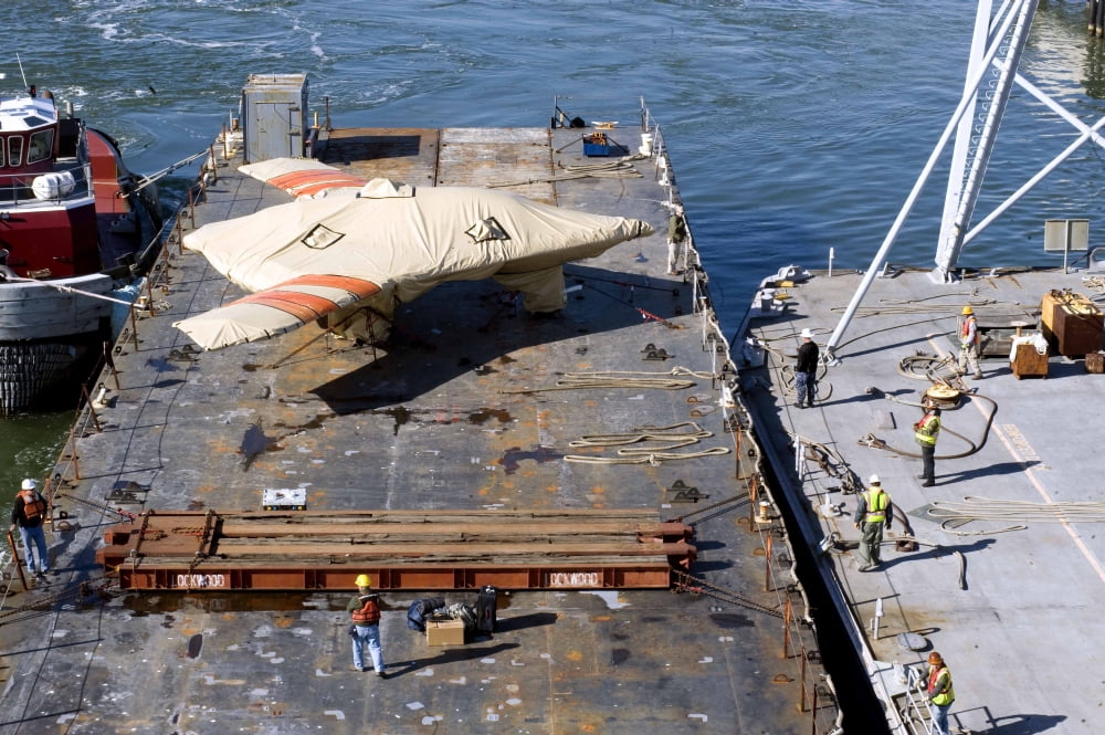 Contractors prepare to hoist the X-47B Unmanned Combat Air System Canvas Art - Stocktrek Images (35 x 23)