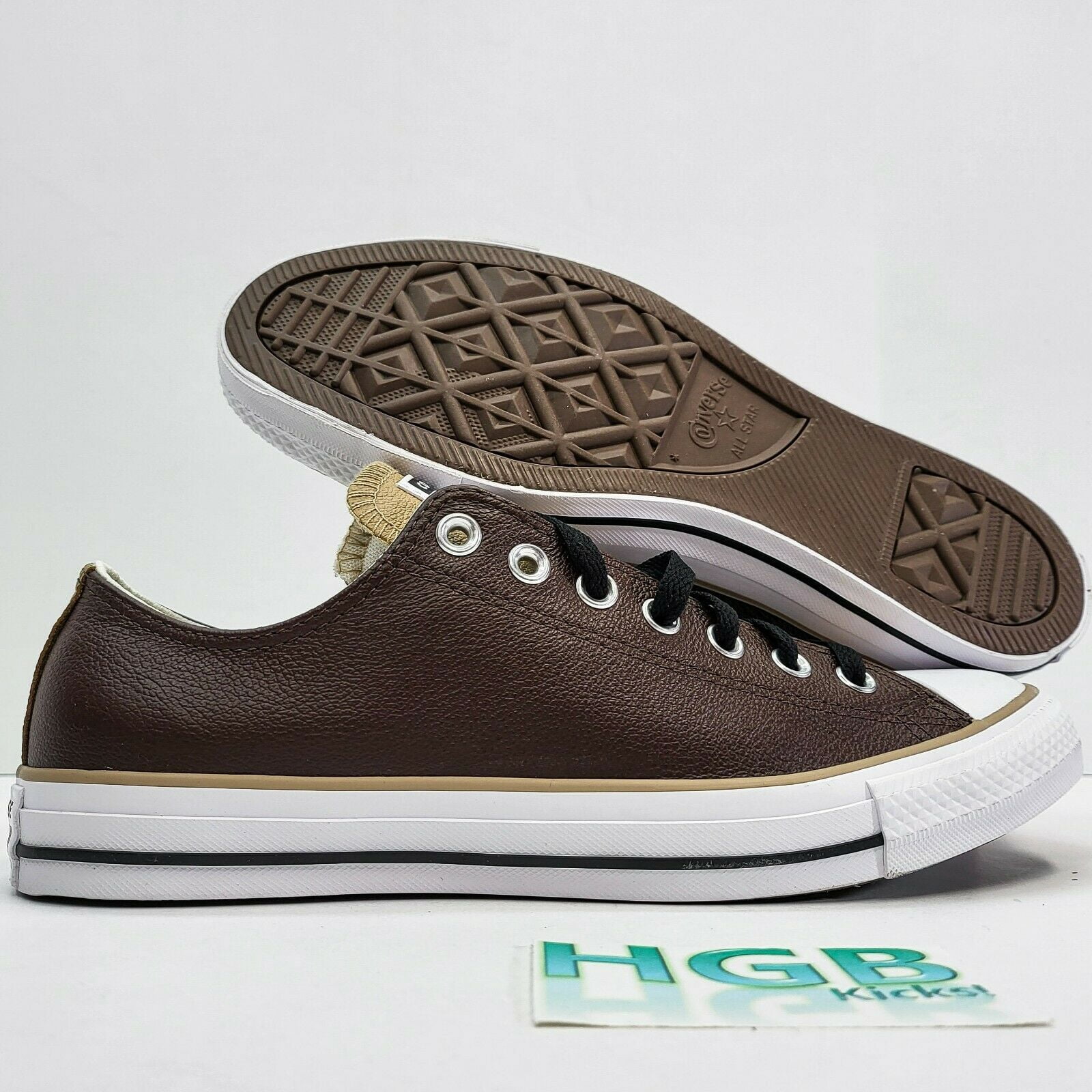 Converse brown leather low tops hotsell