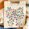 thumbnail image 1 of Coquette Christmas Light Bow Sweater, Xmas Coquette Bow Holiday Light Christmas Sweatshirt, 1 of 5